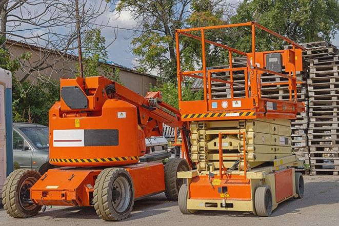 forklift carrying pallets in a warehouse in Apple Valley